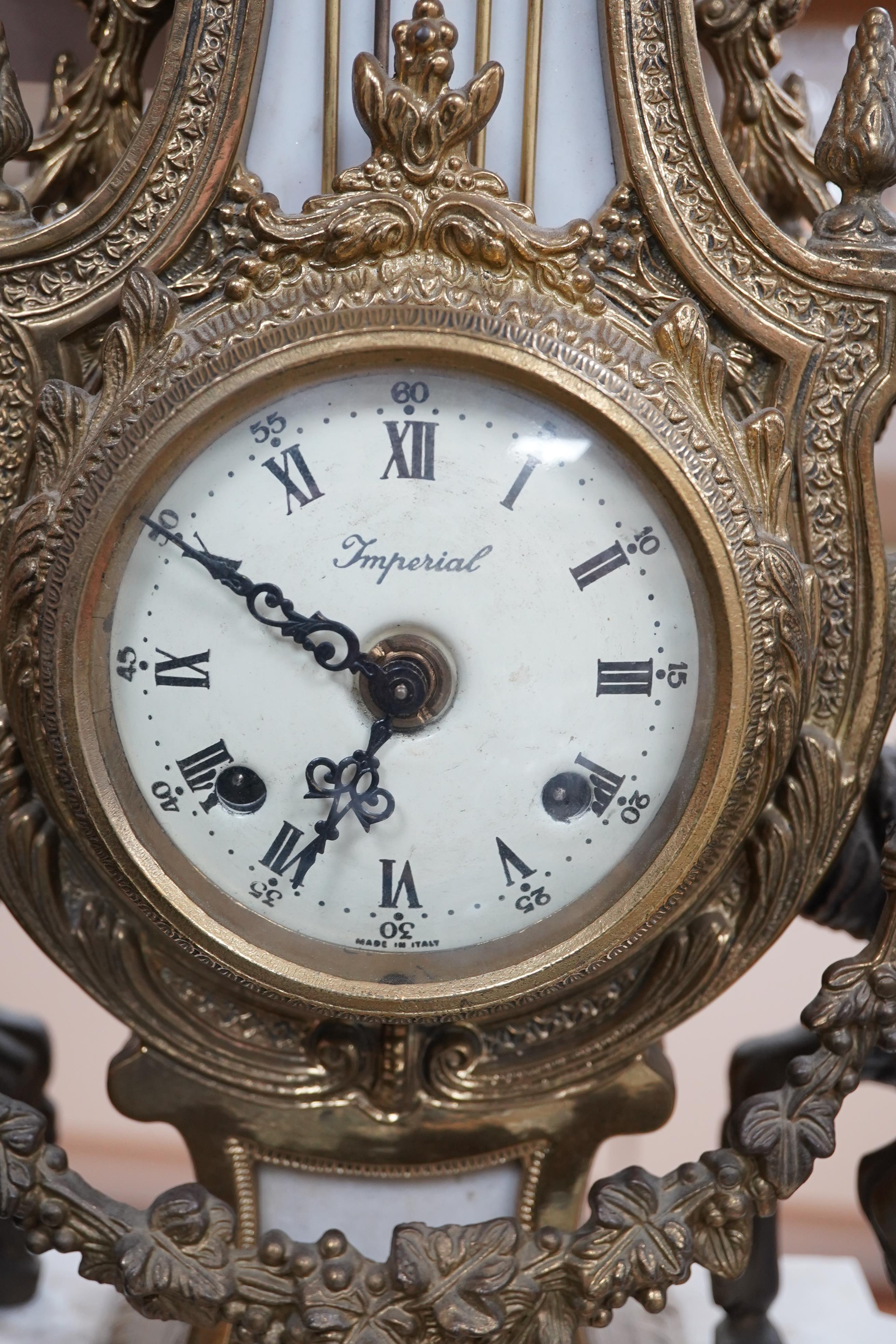 A Louis XV style brass and marble mantel clock, with key, 60cm tall. Condition - good